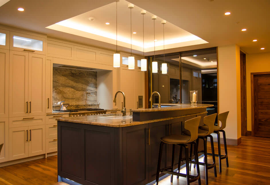 Kitchen lighting in luxury home in Scotland with Photonstar colour tuneable downlights, over island pendants, kicker lighting, cupboard lighting, DALI controllable, wireless lighting control